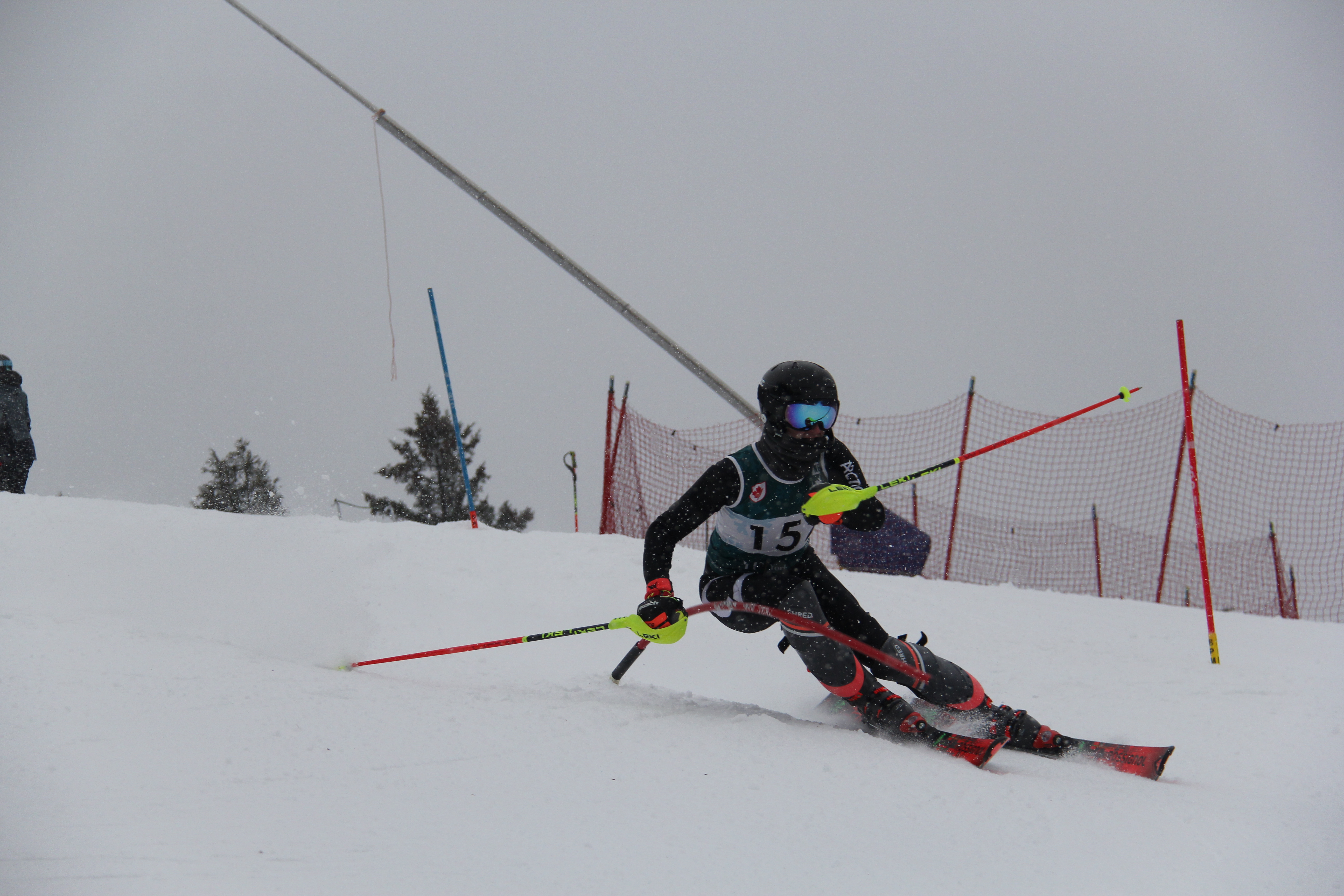 Ski NB athlete racing through gates
