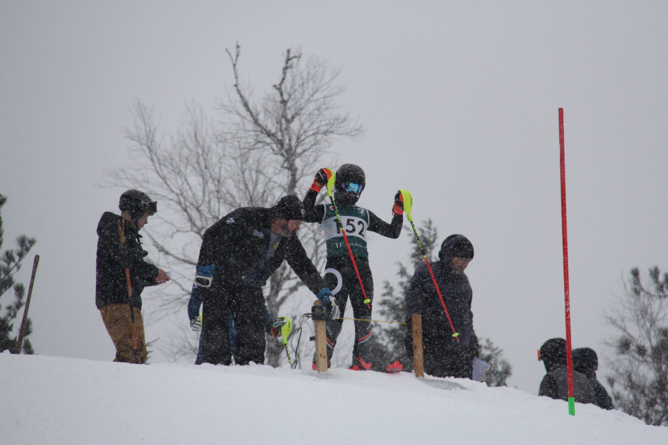 Race officials assisting an athlete at the course